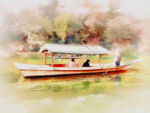 Tourists sightseeing on boats on katsura river ,Kyoto Japan.