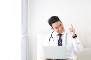 portait of Asian doctor in hospital white background
