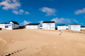 pretty landscape with beach cabins on the coast in northern France