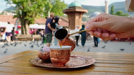 Serving black bosnian coffee at Bascarsija square in old town of Sarajevo