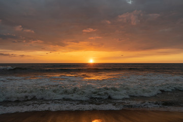 Fototapeta na wymiar Beautiful sunset on the shore of the Indian Ocean