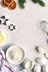 Christmas festive baking background with ingredients for making cake or biscuit. Top view with copy space.