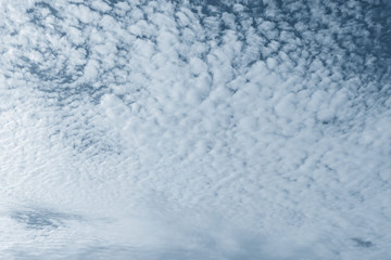 Sky in cirrus clouds in classic blue.