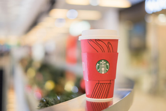 HONGKONG, CHINA - DEC 12, 2017: Hot coffee latte Starbucks coffee and popular holiday beverage for christmas celebration served in the new 2017 designed holiday cups.