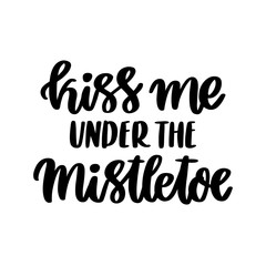 The hand-drawing inspirational quote: Kiss me under the mistletoe, in a trendy calligraphic style. It can be used for card, mug, brochures, poster, t-shirts, phone case etc.