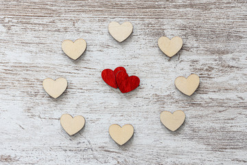 Red and white hearts on a wooden background. Valentines day concept