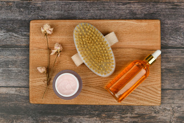 Skin care products on a wooden background. Anti-cellulite massage brushes. view from above. Massage brush. Accessories for massage. Flatley. eco care concept. Skin care products on white.
