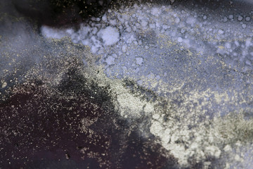 Blur Abstract black and gold paint blots background. Marble texture.