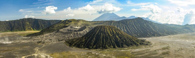 View from above, stunning panoramic view of the Mount Batok and the Mount Bromo illuminated at...