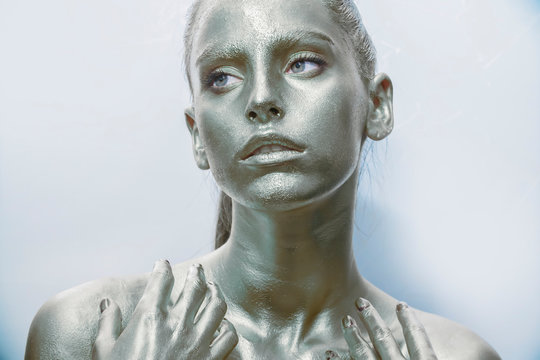 Close-up silver portrait of a woman with glitter make-up
