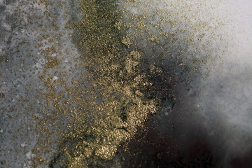 Blur Abstract black and gold paint blots background. Marble texture.