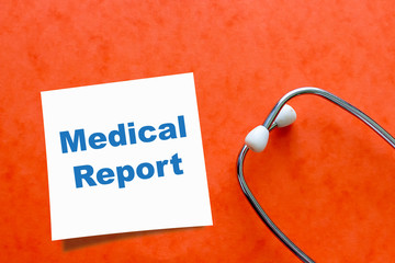 Medical Report on white sticky note with stethoscope