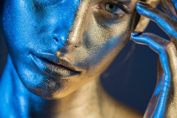 Close-up silver portrait of a woman with glitter make-up