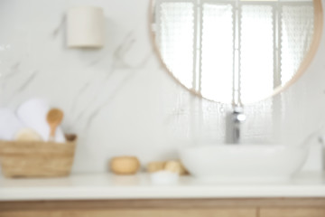 Blurred view of stylish modern bathroom with mirror