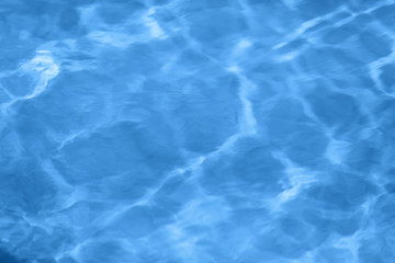 Classic blue sea water surface texture. Toned color of the year 2020 trendy blue background. Main color trend concept.