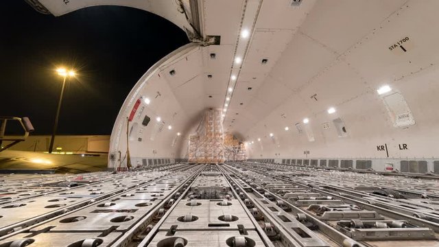 Time lapse unloading cargo inside cargo plane	