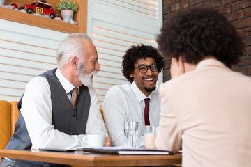 Three co-workers bonding at a break.