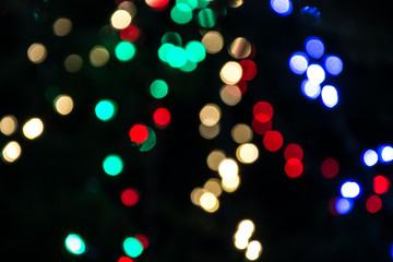Bright colorful christmas bokeh isolated on black background, Xmas tree light texture, new year holiday decoration