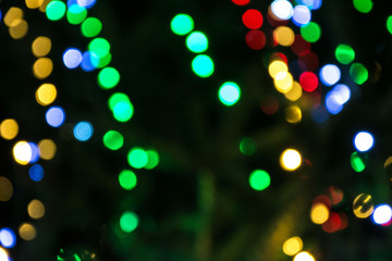 Bright colorful christmas bokeh isolated on black background, Xmas tree light texture, new year holiday decoration