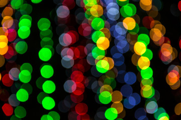 Bright colorful christmas bokeh isolated on black background, Xmas tree light texture, new year holiday decoration