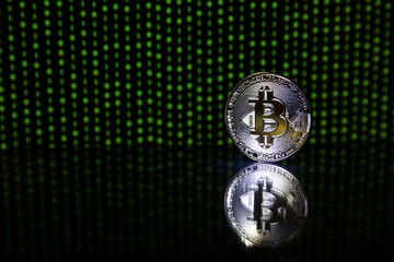 bitcoin coin on black background with copy space