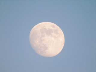 Beautiful caption of the moonlight by day with an incredible blue sky in the background.