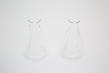 Scientific laboratory glass erlenmeyer flask isolated on white background
