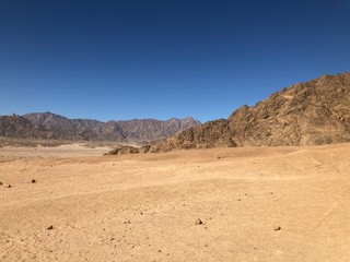 Fototapeta na wymiar Landscape Sandy mountains, blue sky in the desert of Egypt.