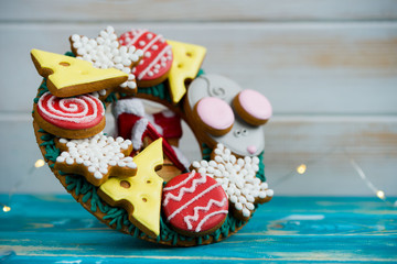 Beautiful and delicious gingerbread with pieces of cheese, mouse, balls for the Christmas tree.