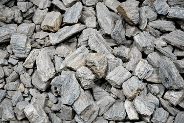 the texture of the stones for intros or background. smooth sea stones and large sharp gravel construction.