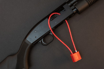 12 Gauge shotgun with cable lock.