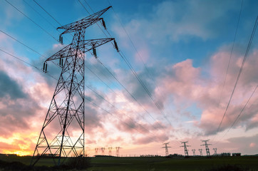 set of electric pylons at sunset
