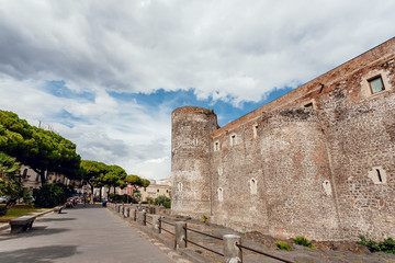 Fototapeta na wymiar Towers of 13th century Castello Ursino in italian city Catania. Historical landscape