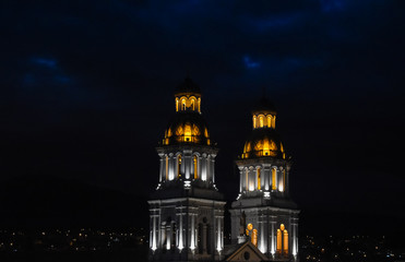 Fototapeta na wymiar Church towers illuminated at night