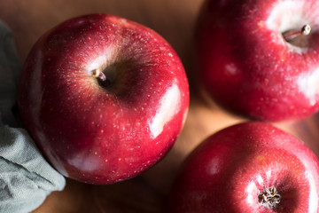 Apples very red and bright, appetizing, on a table