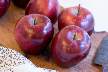 Apples very red and bright, appetizing, on a table