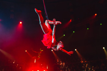 performance of aerialists in the circus arena.