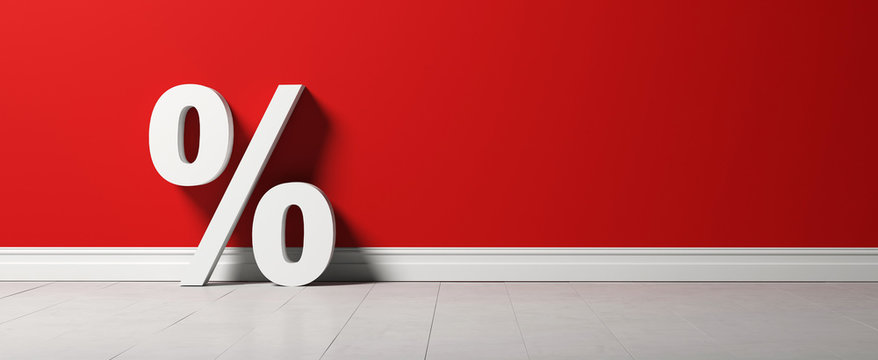 a percent sign in front of a red wall