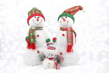 Family of snowmen isolated on white with copy space. Snowmen greeting card