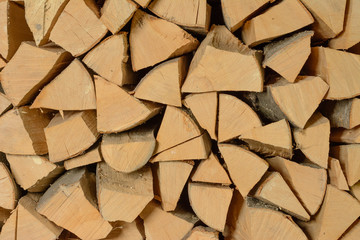 The texture of the wall is firewood, which is laid out very neatly.