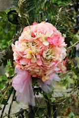 A pink bridal bouquet weathered by the elements