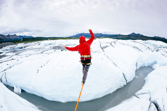 Rear view of man slacklining at Matanuska Glacier