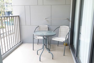 table and chairs in hotel room.