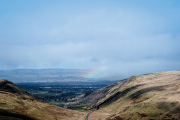 Rainbow in the valley, seen from Glen Sherup, Scotland