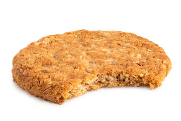 Crunchy oat and wholemeal biscuit isolated on white. Missing bite.