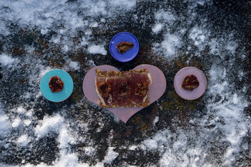  A pink heart  with  Traditional  tapas    with  spanish cured meat and  bread chips with seed and ...