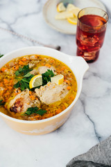 Chicken Escabeche with Fresh Parsley on Marble Background