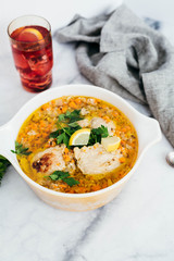 Chicken Escabeche with Fresh Parsley on Marble Background
