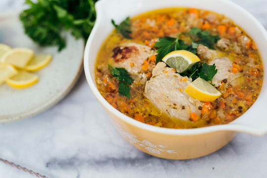 Chicken Escabeche With Fresh Parsley On Marble Background