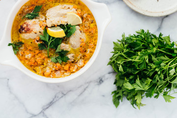 Chicken Escabeche with Fresh Parsley on Marble Background